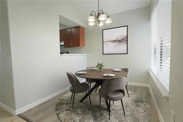 en empty room with wooden floor and window