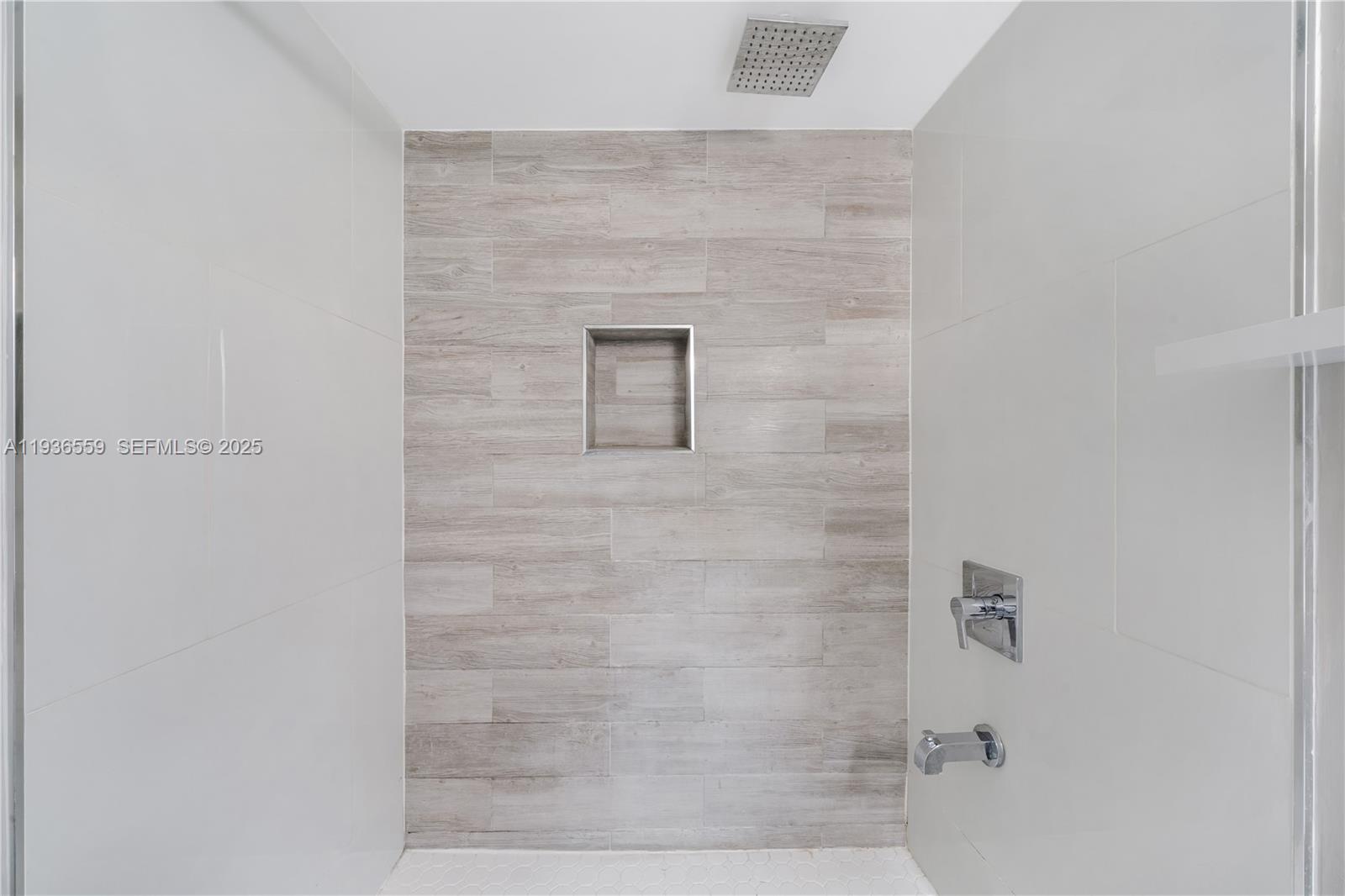 8095 Northwest 8th Street, Unit 412 Miami, FL 33126 - Photo 17 of 20 a bathroom with a shower