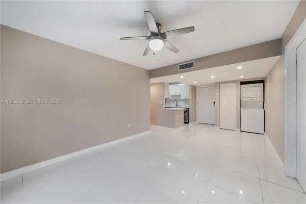 an empty room with a empty space and a ceiling fan