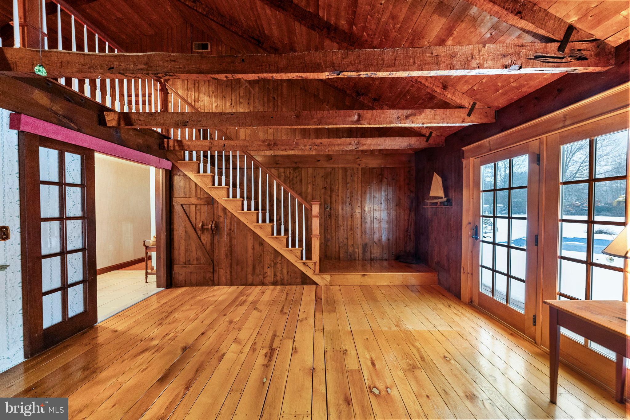 402 Main Street Manalapan, NJ 07726 - Photo 12 of 44 Rustic charm in a sunlit wooden retreat.