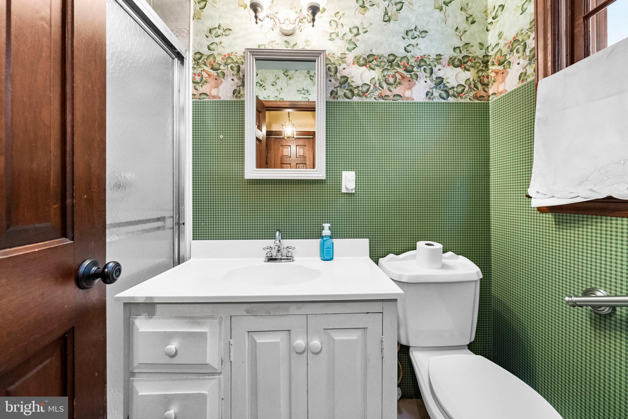 402 Main Street Manalapan, NJ 07726 - Photo 30 of 44 Charming bathroom with vintage floral accents.