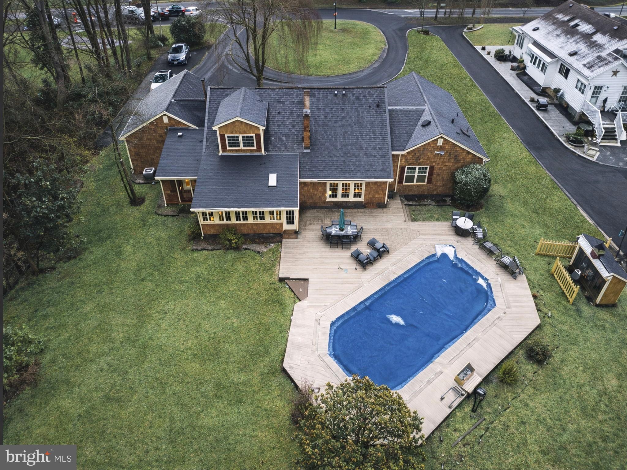 402 Main Street Manalapan, NJ 07726 - Photo 3 of 44 Charming home with inviting poolside retreat.