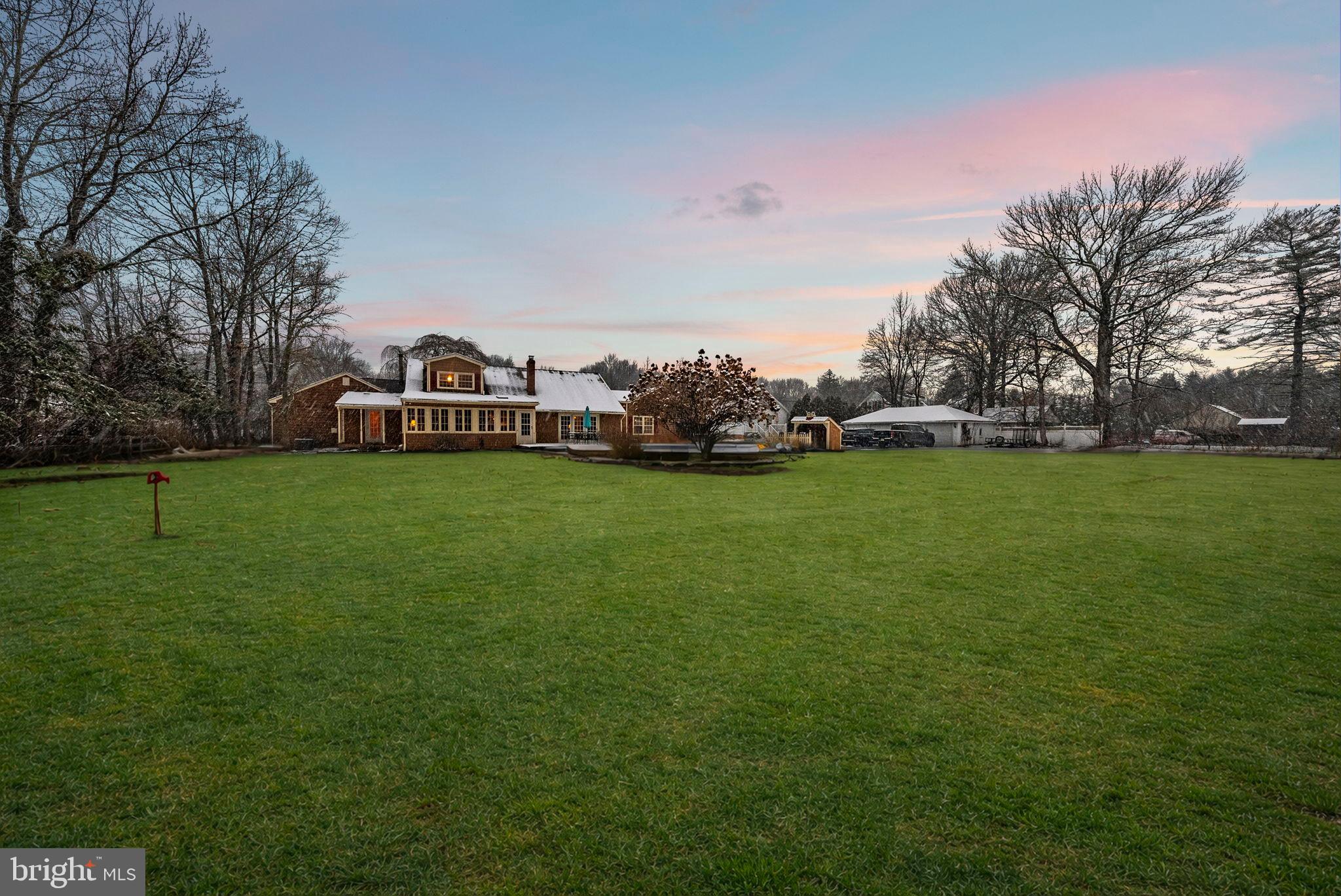 402 Main Street Manalapan, NJ 07726 - Photo 5 of 44 Serene home nestled in lush greenery.