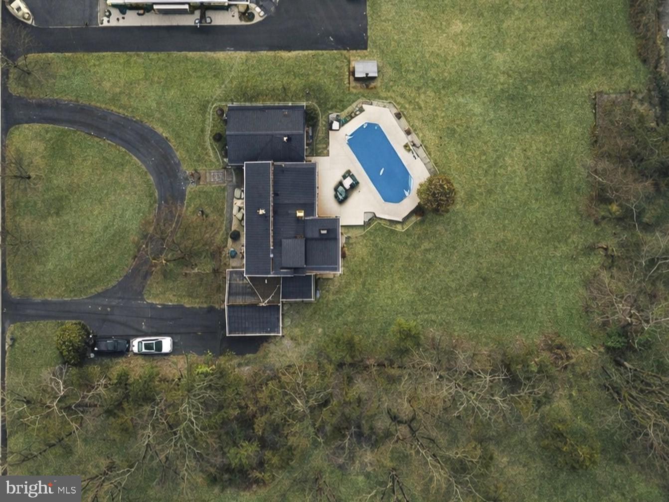 402 Main Street Manalapan, NJ 07726 - Photo 7 of 44 Spacious home with a serene poolside retreat.