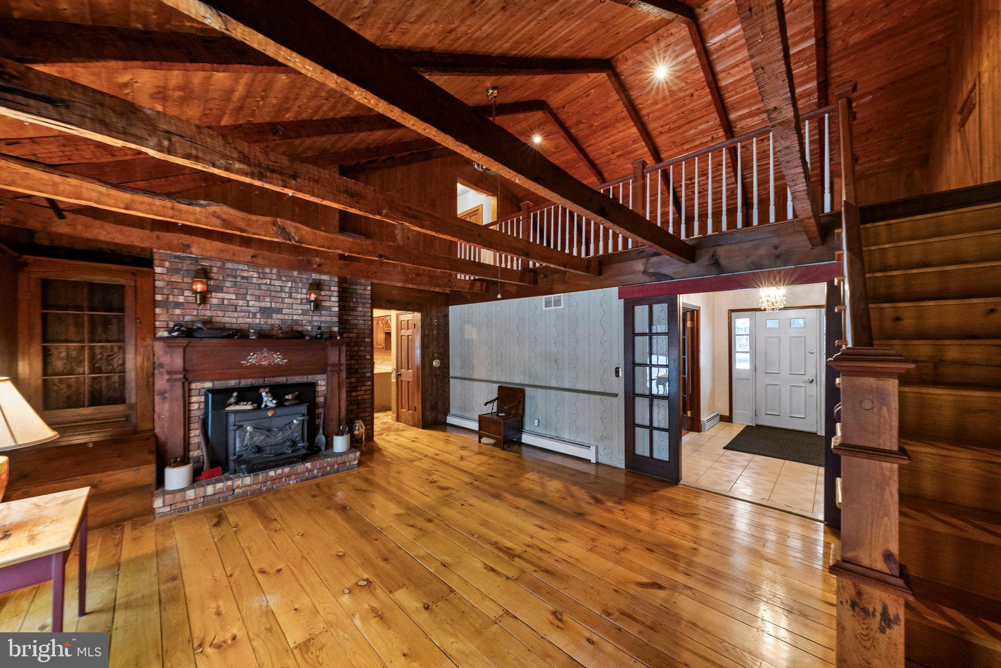 402 Main Street Manalapan, NJ 07726 - Photo 9 of 44 Spacious rustic retreat with wooden charm.