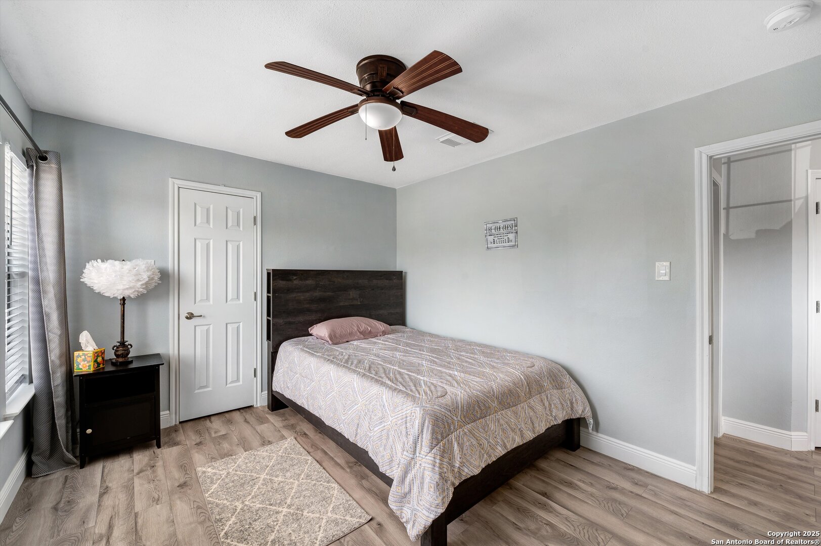 7624 Lonecrest Lane Converse, TX 78109 - Photo 25 of 32 a bedroom with a bed and a walk in closet