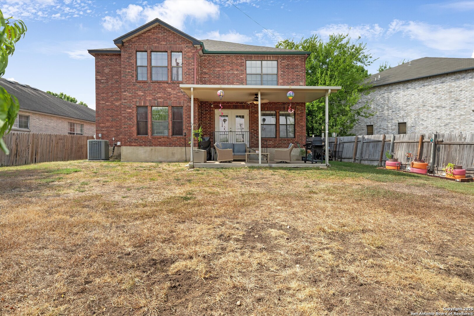 7624 Lonecrest Lane Converse, TX 78109 - Photo 27 of 32 a view of a house with a yard and large tree