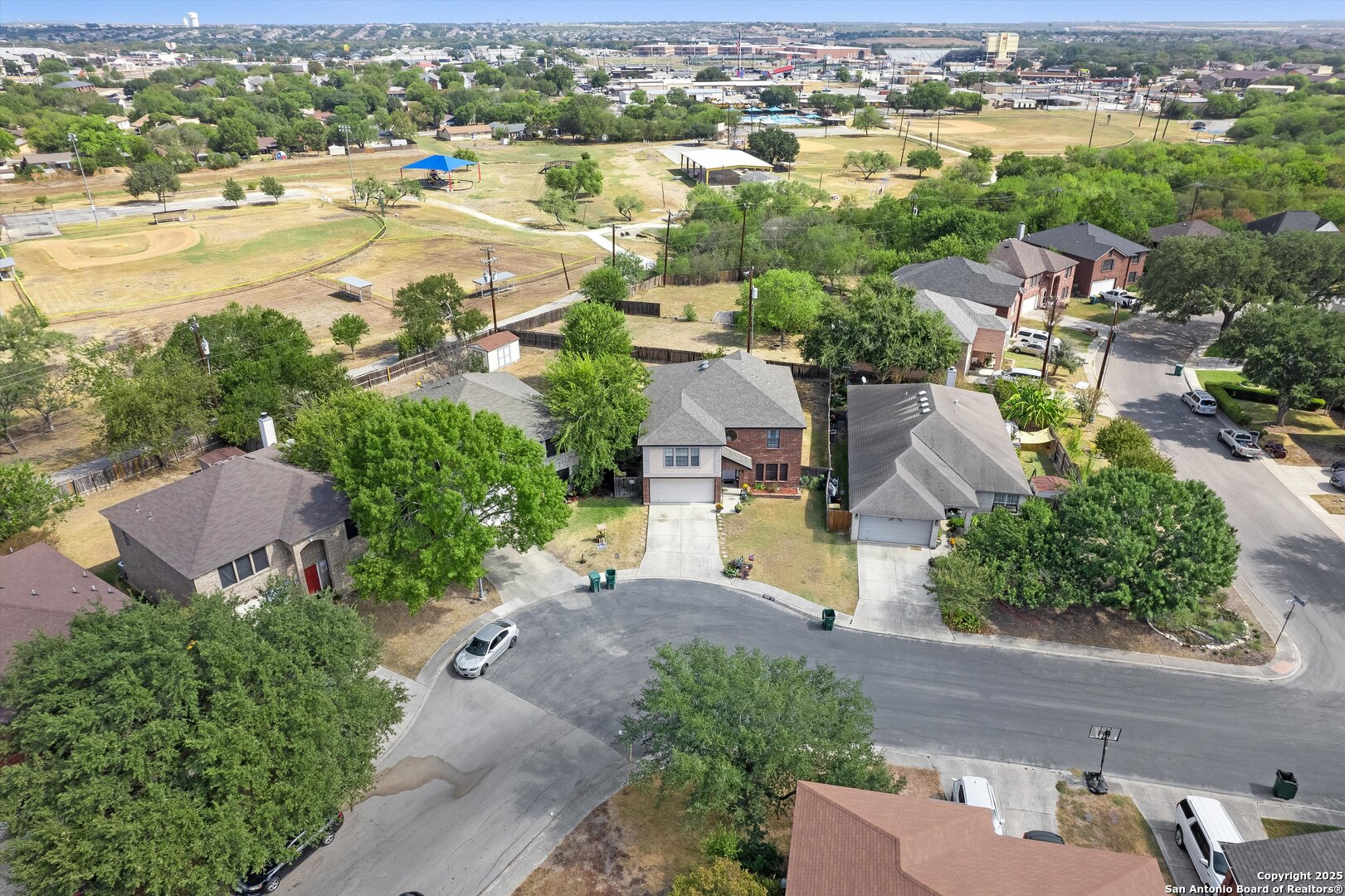 7624 Lonecrest Lane Converse, TX 78109 - Photo 30 of 32 an aerial view of a city with lots of residential buildings