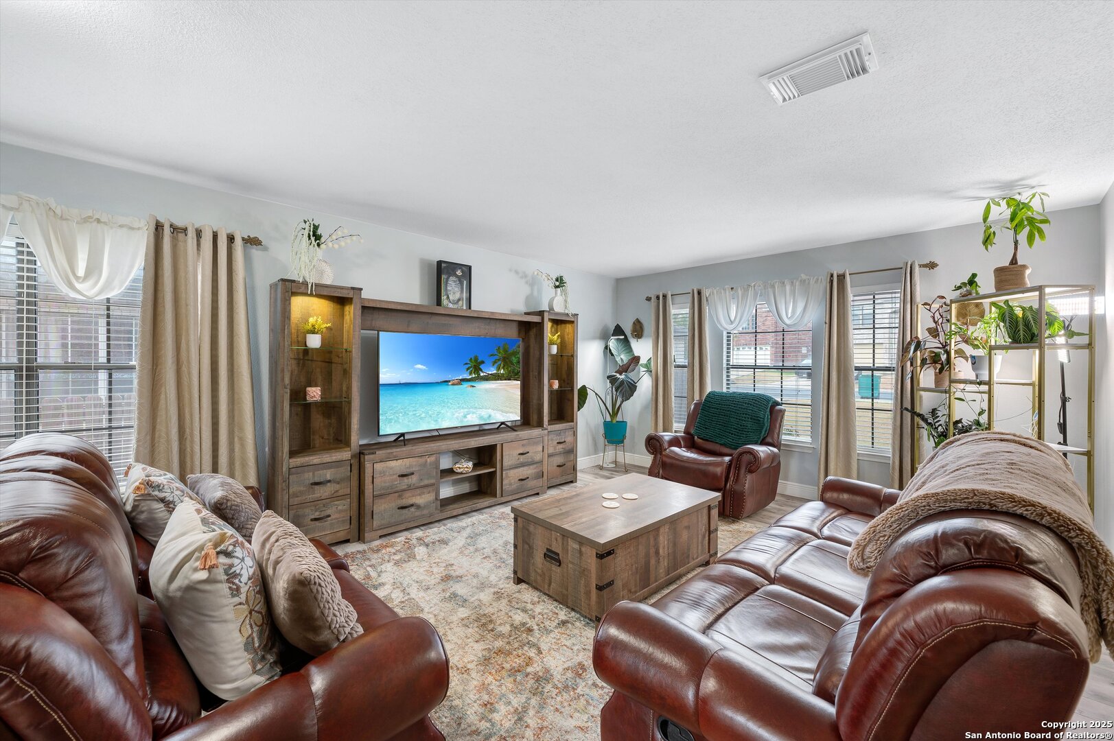 7624 Lonecrest Lane Converse, TX 78109 - Photo 5 of 32 a living room with furniture and a flat screen tv