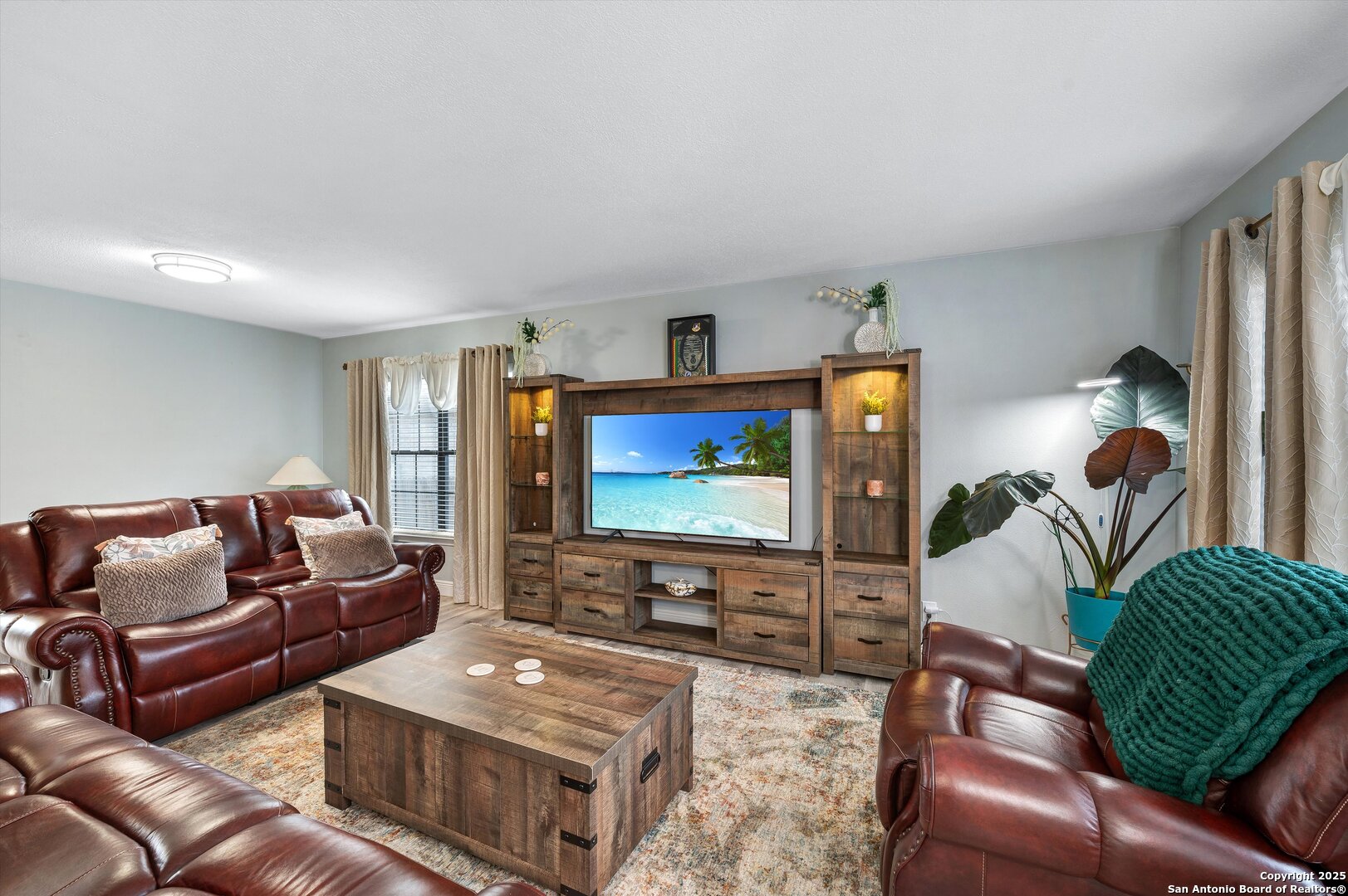 7624 Lonecrest Lane Converse, TX 78109 - Photo 6 of 32 a living room with furniture and a flat screen tv