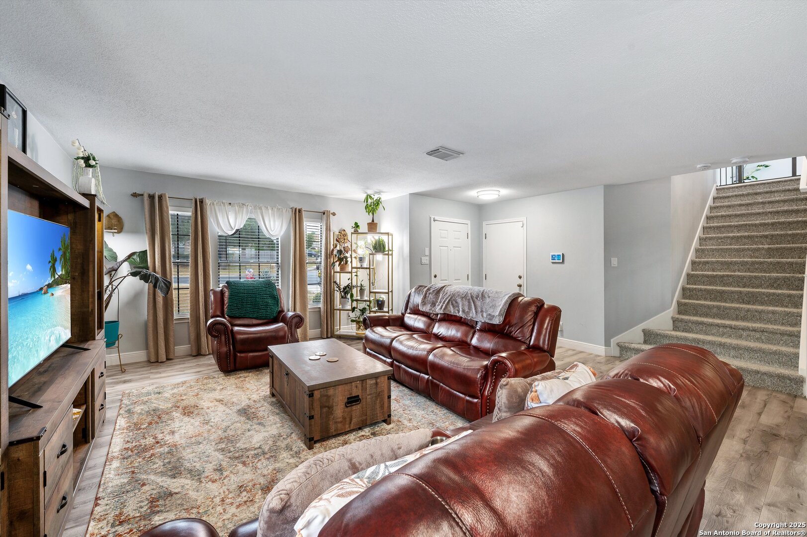 7624 Lonecrest Lane Converse, TX 78109 - Photo 7 of 32 a living room with furniture and a flat screen tv