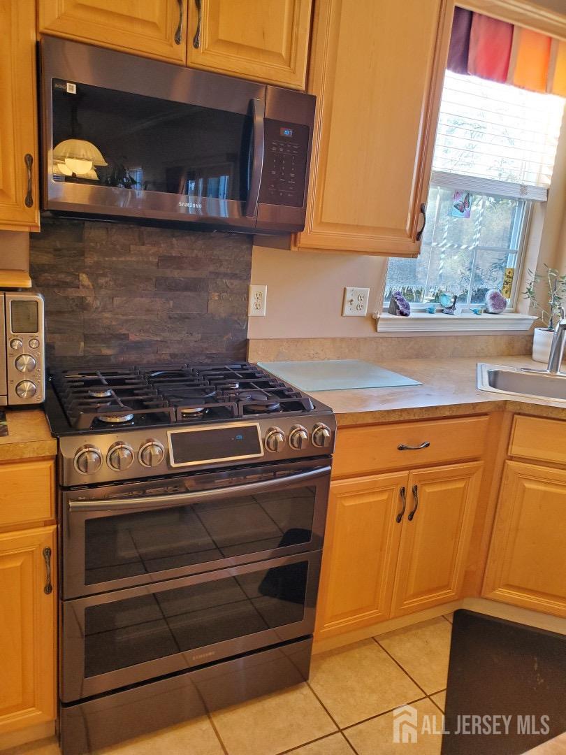 14 Young Way Bridgewater, NJ 08807 - Photo 18 of 38 a stove top oven sitting inside of a kitchen