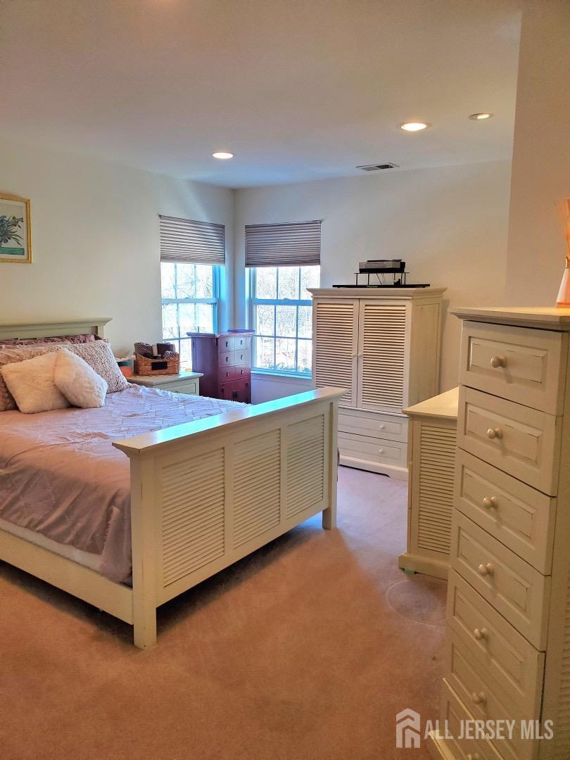 14 Young Way Bridgewater, NJ 08807 - Photo 29 of 38 a bedroom with a bed and a dresser