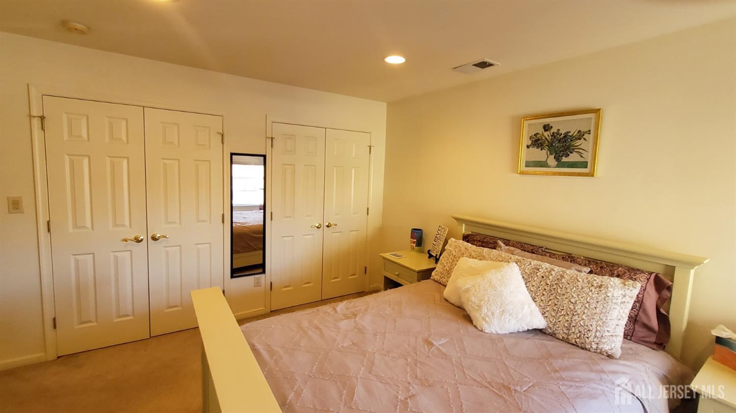 14 Young Way Bridgewater, NJ 08807 - Photo 30 of 38 a bedroom with a bed and a painting on the wall