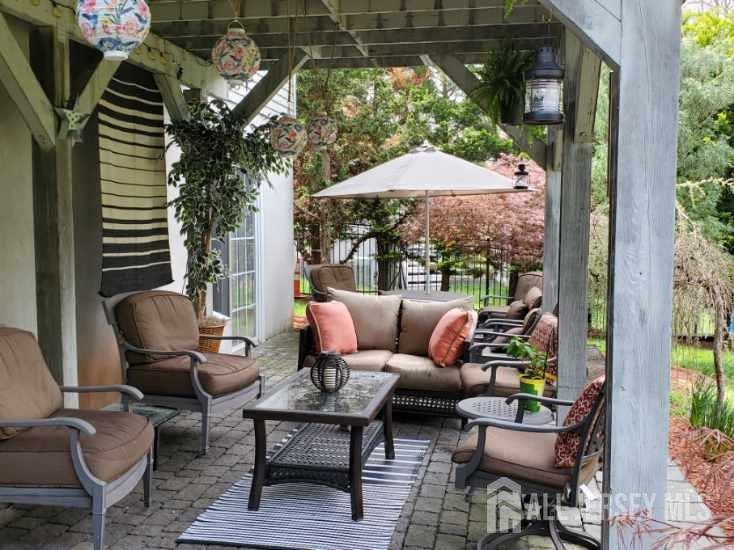 14 Young Way Bridgewater, NJ 08807 - Photo 36 of 38 a backyard of a house with outdoor seating