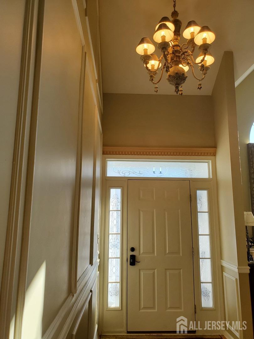 14 Young Way Bridgewater, NJ 08807 - Photo 6 of 38 a bathroom with a chandelier fan and a shower