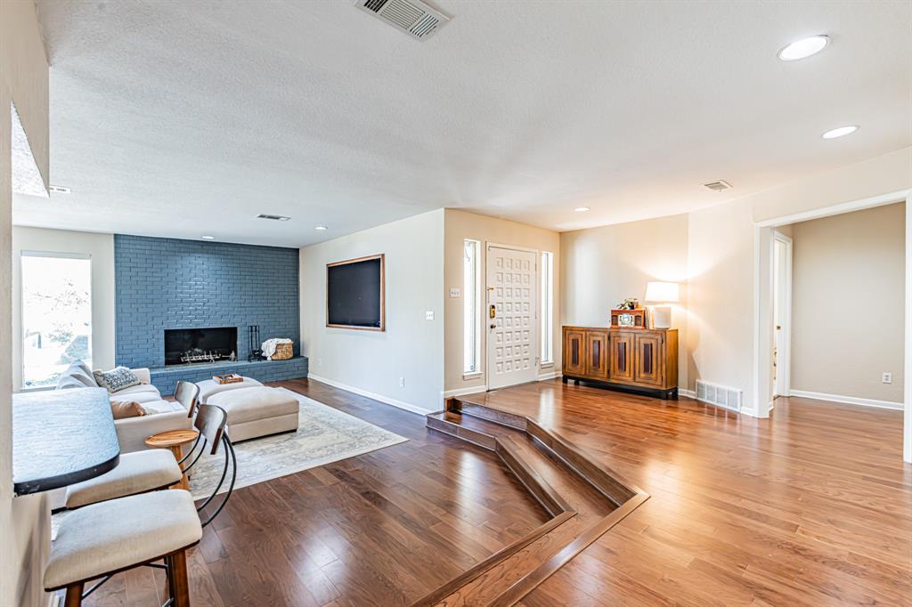 18 Crosslands Road Benbrook, TX 76132 - Photo 6 of 39 Wood burning fireplace. Framed TV conveys.