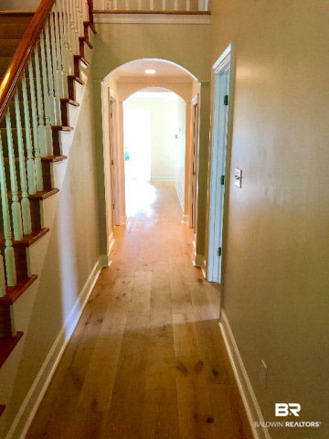 1515 2nd Street Daphne, AL 36526 - Photo 3 of 23 For Sale: 1515 Second Street, Daphne, AL 36526 Hallway from Front Door to Master Bedroom and then Kitchen