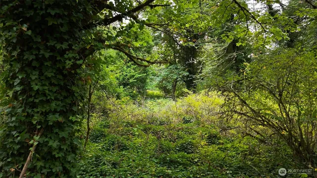 a view of a sign board with yard