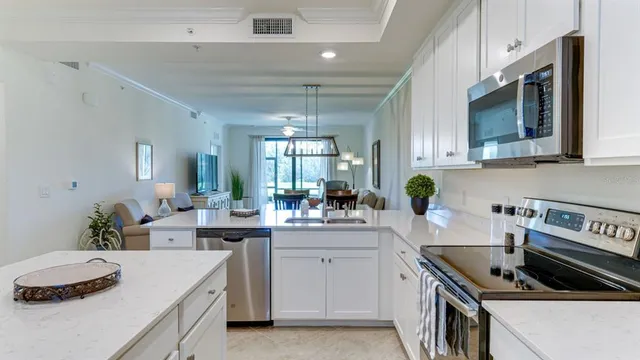 a kitchen with a sink stove and cabinets