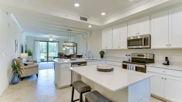 a kitchen with a stove a sink and a refrigerator
