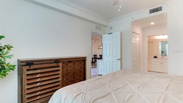 a bedroom with a bed and a cabinets