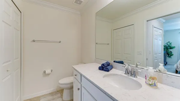 a bathroom with a sink toilet and vanity