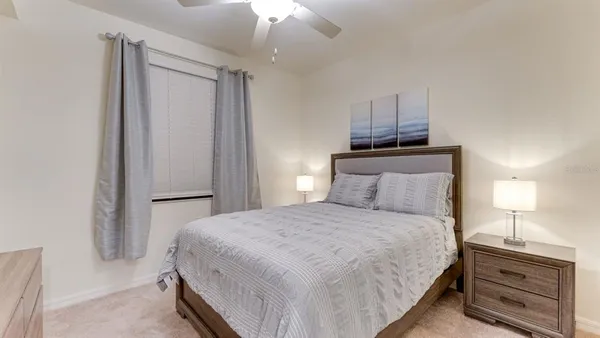 a bedroom with a bed and a cabinets
