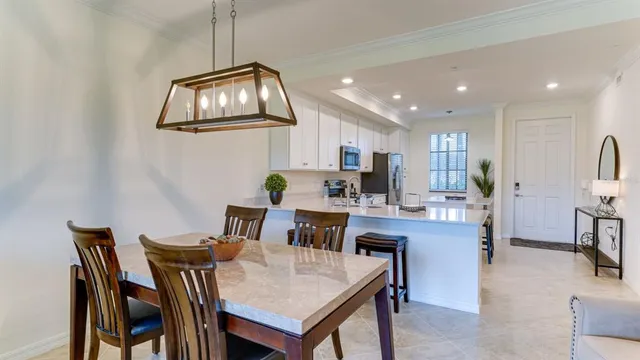 a view of kitchen dining table and chairs