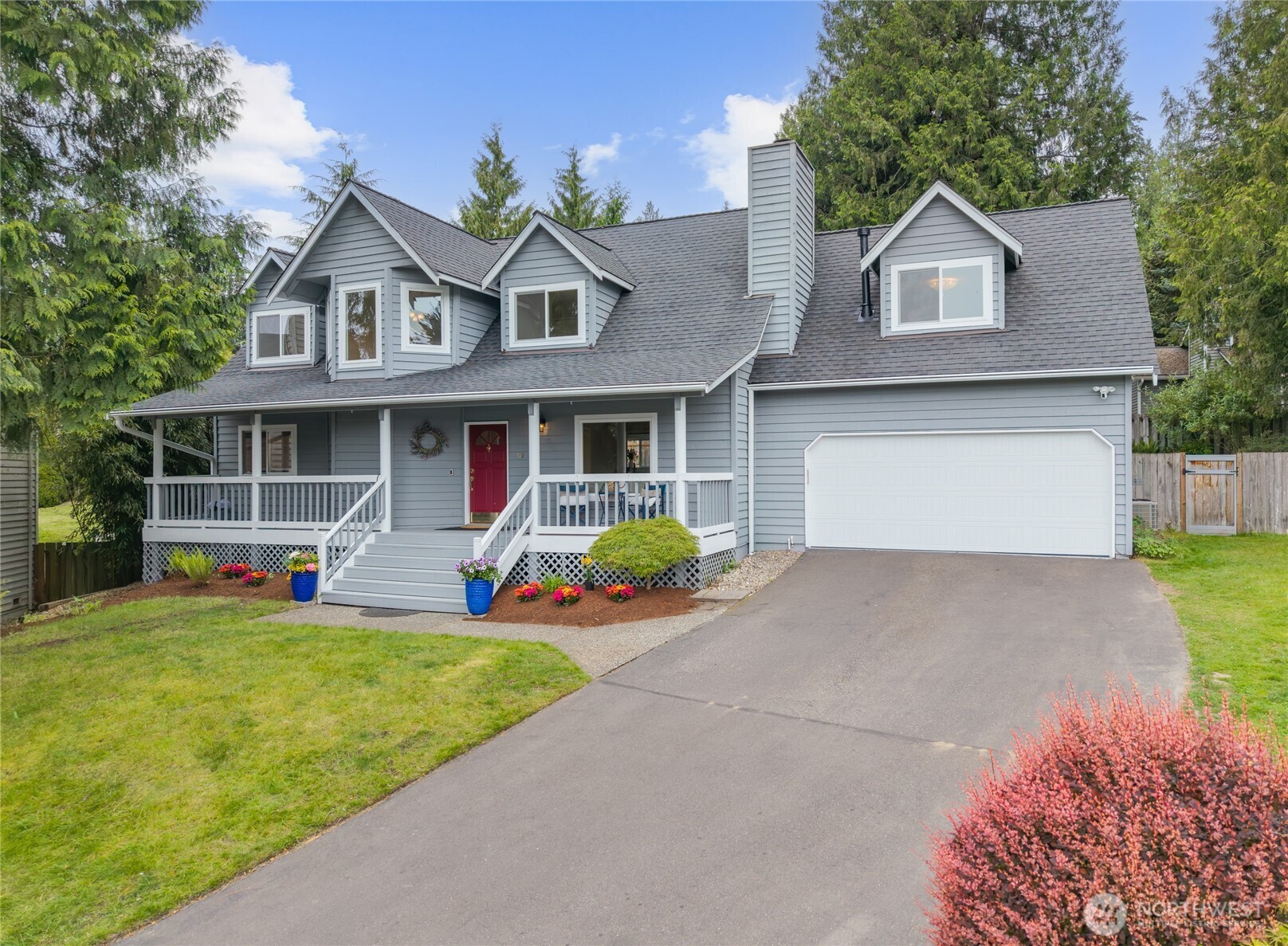 412 164th Place Southeast Bothell, WA 98012 - Photo 2 of 39 a front view of a house with swimming pool and porch