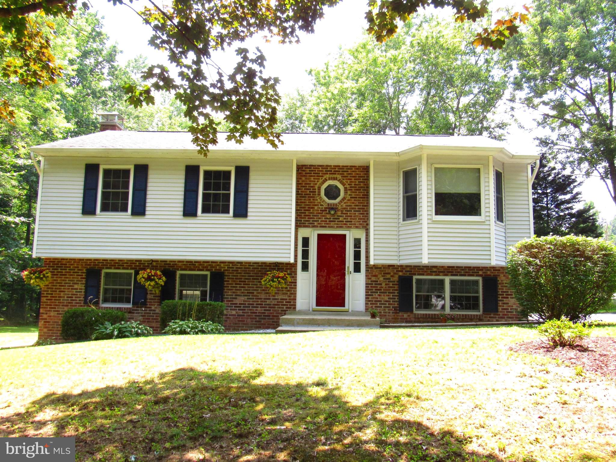 3235 Richfield Road Huntingtown, MD 20639 - Photo 5 of 64 a front view of a house with a yard