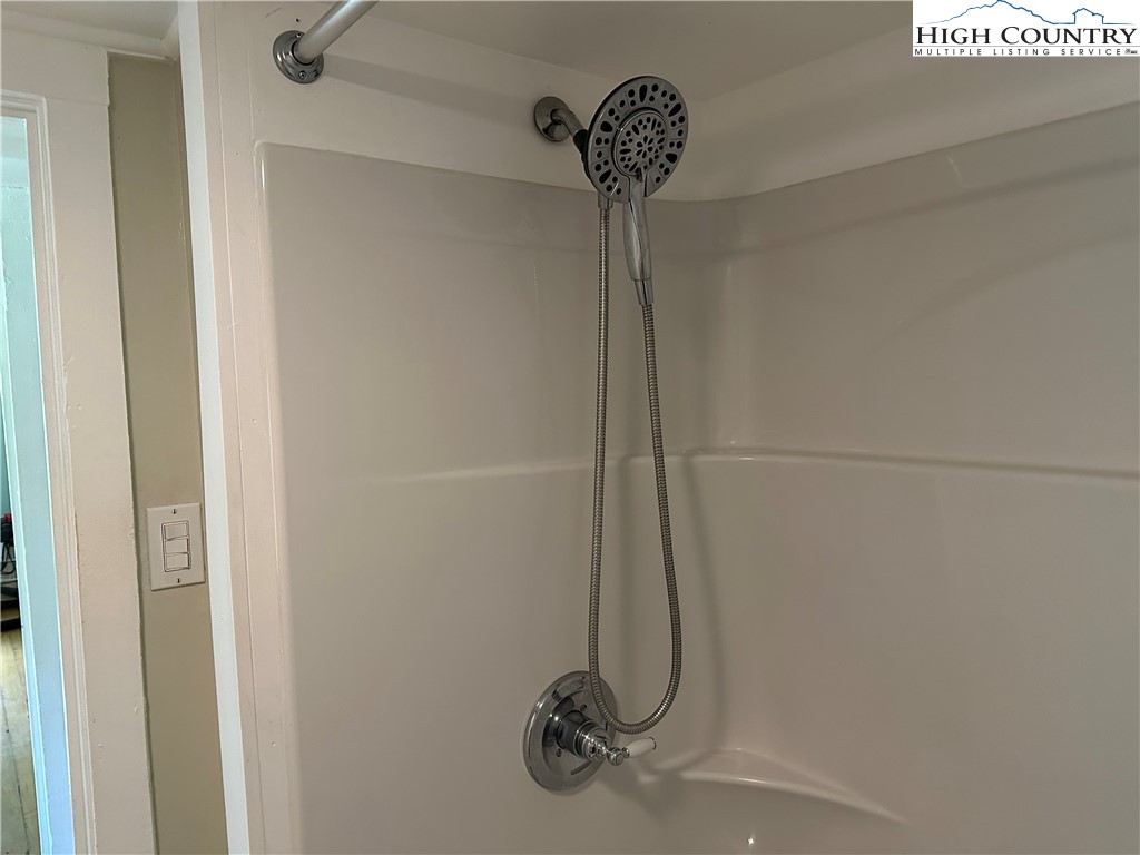 405 Wilson Road Ennice, NC 28623 - Photo 14 of 29 a bathroom with a shower