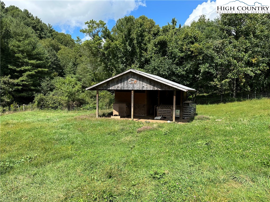 405 Wilson Road Ennice, NC 28623 - Photo 23 of 29 a front view of a house with yard and green space