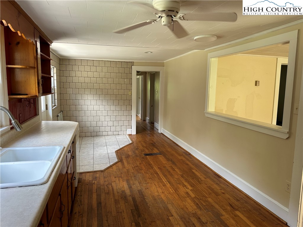 405 Wilson Road Ennice, NC 28623 - Photo 8 of 29 a view of a kitchen with a sink dishwasher and a refrigerator