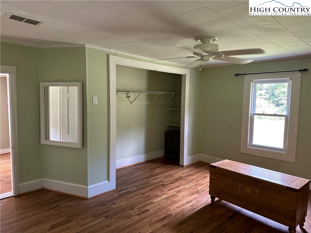 405 Wilson Road Ennice, NC 28623 - Photo 10 of 29 a bedroom with a bed and a window