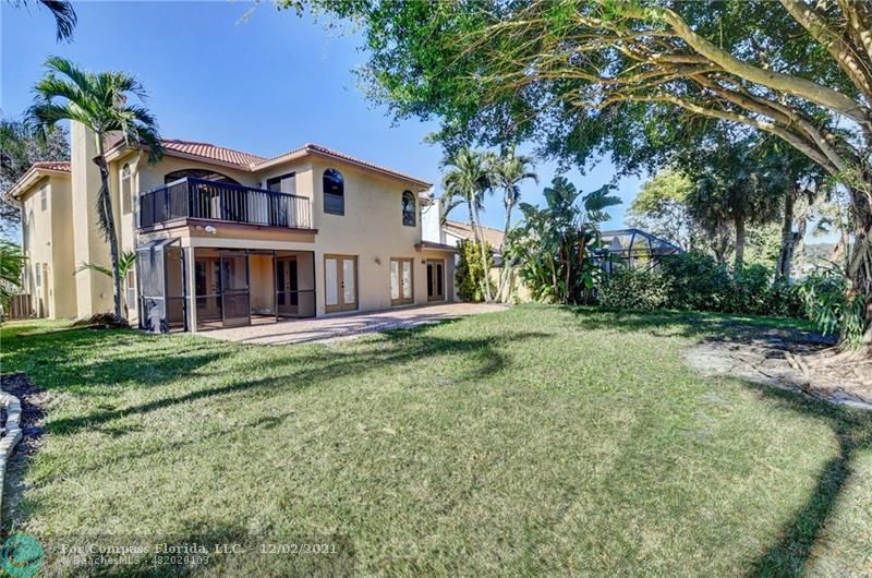 Mission Bay Boca Raton, FL 33428 - Photo 11 of 33 a view of a house with a yard and plants