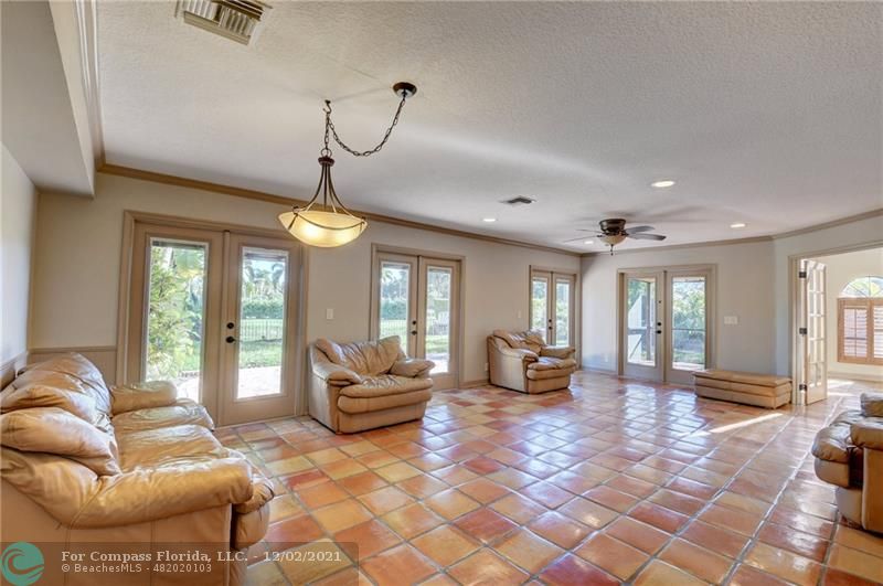 Mission Bay Boca Raton, FL 33428 - Photo 17 of 33 a living room with furniture and a large window