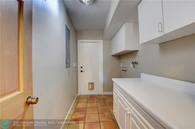 Mission Bay Boca Raton, FL 33428 - Photo 23 of 33 a room with a washing machine