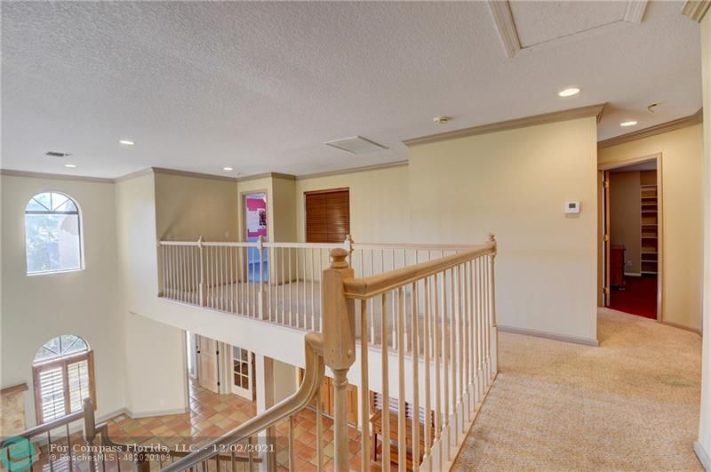 Mission Bay Boca Raton, FL 33428 - Photo 24 of 33 a view of a hallway with an entryway