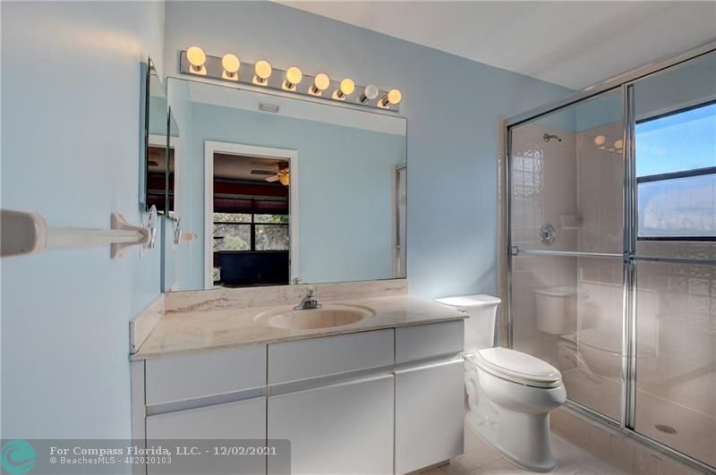 Mission Bay Boca Raton, FL 33428 - Photo 27 of 33 a bathroom with a sink toilet and shower