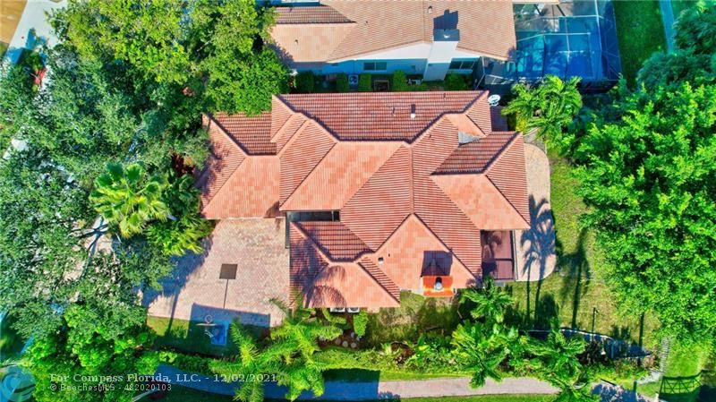 Mission Bay Boca Raton, FL 33428 - Photo 6 of 33 an aerial view of a house with a garden