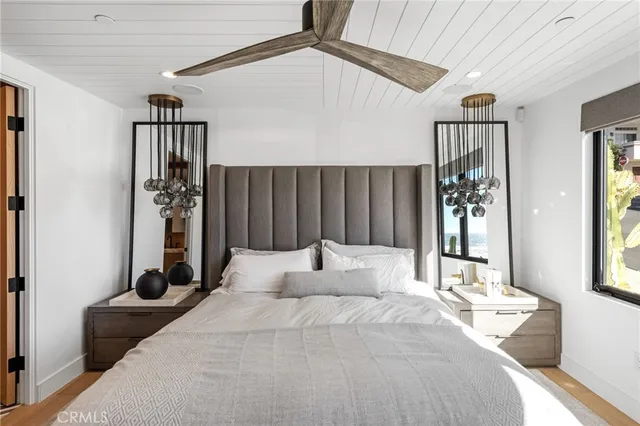 a bedroom with a large bed and a window