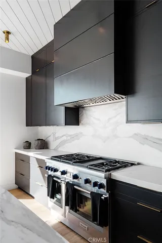a kitchen with a stove and a sink