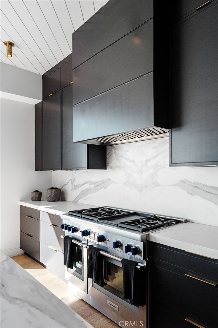 2200 The Strand, Unit A Manhattan Beach, CA 90266 - Photo 30 of 38 a kitchen with a stove and a sink