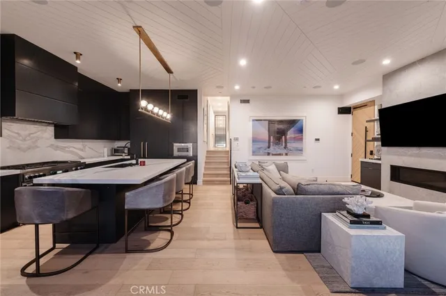 a living room with fireplace furniture and a flat screen tv