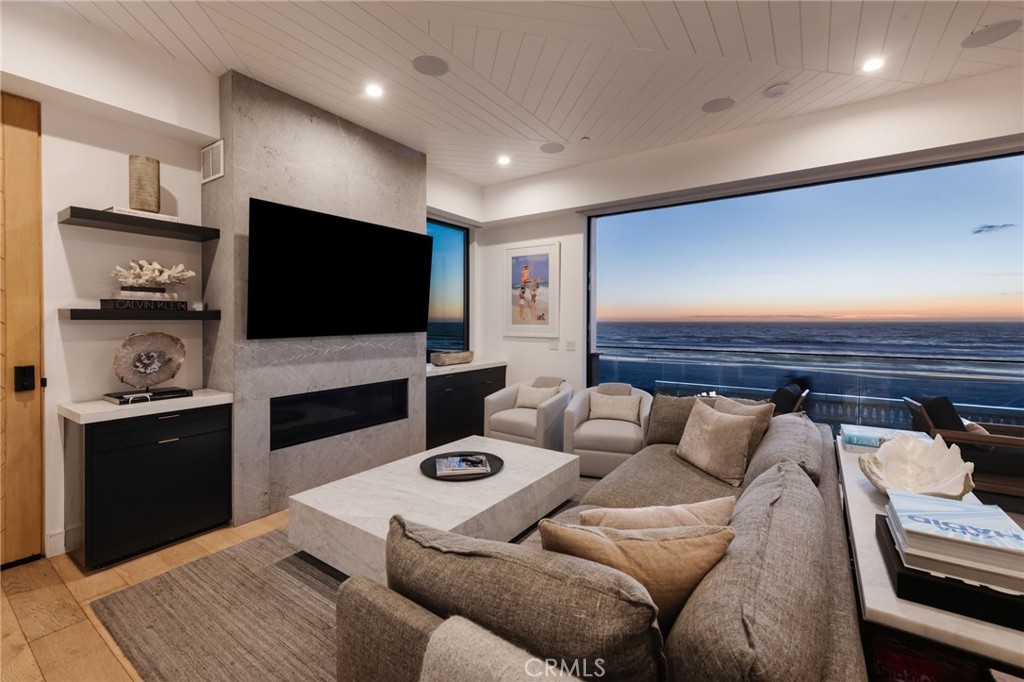 2200 The Strand, Unit A Manhattan Beach, CA 90266 - Photo 9 of 38 a living room with furniture and a flat screen tv