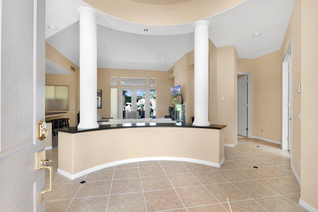 8 MacBeth Court Rancho Mirage, CA 92270 - Photo 4 of 46 a view of a living room and kitchen with furniture