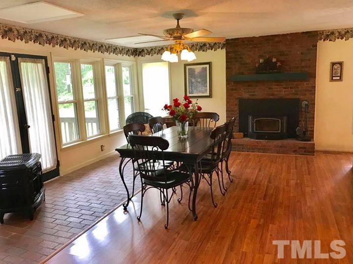 2685 Ridgeville Road Prospect Hill, NC 27314 - Photo 17 of 25 a view of a dining room with furniture window and wooden floor