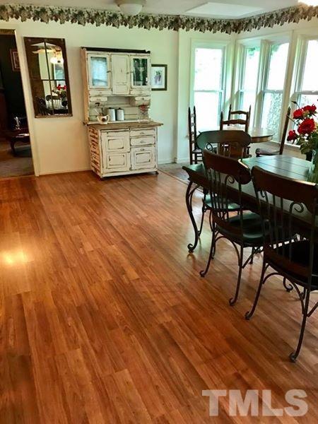 2685 Ridgeville Road Prospect Hill, NC 27314 - Photo 19 of 25 a living room with furniture and a wooden floor
