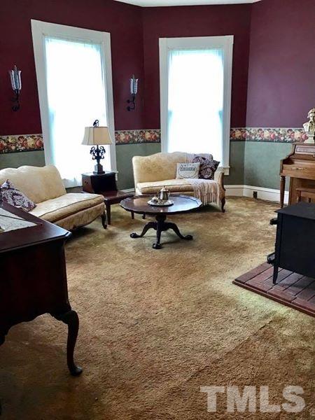 2685 Ridgeville Road Prospect Hill, NC 27314 - Photo 5 of 25 a living room with furniture rug and a window